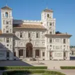 Historic villa with ornate facade and gardens in Rome.